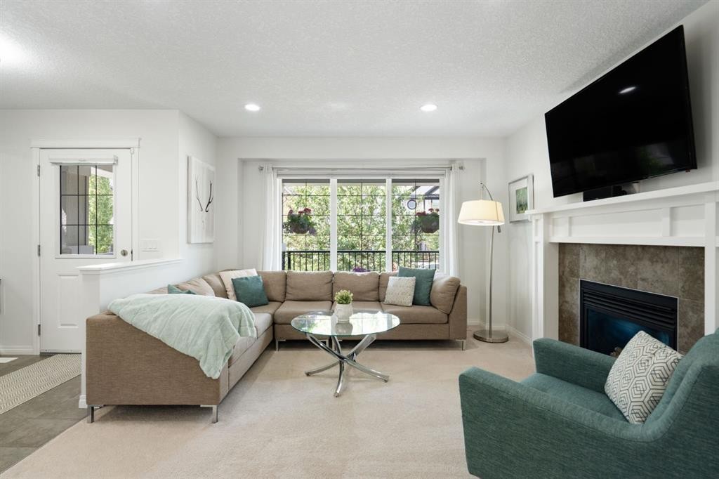 54 Legacy Common Se, Calgary, AB - Indoor Photo Showing Living Room With Fireplace