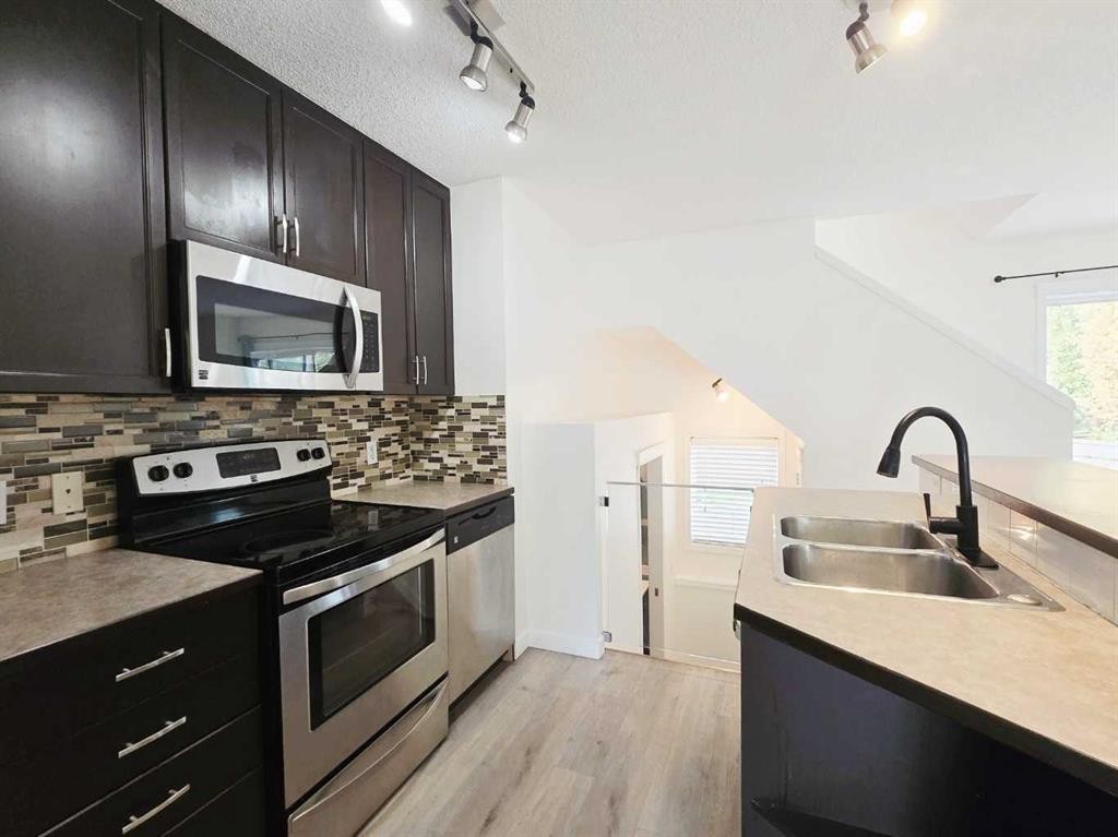 210 Prestwick Circle Se, Calgary, AB - Indoor Photo Showing Kitchen With Stainless Steel Kitchen With Double Sink With Upgraded Kitchen