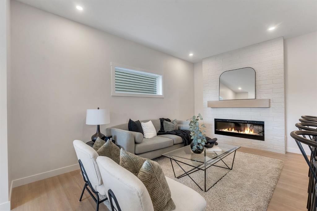 445 Lewiston Landing Ne, Calgary, AB - Indoor Photo Showing Living Room With Fireplace