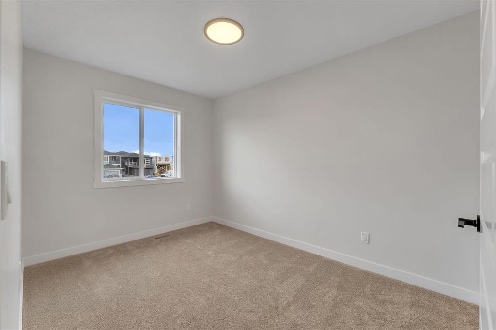 445 Lewiston Landing Ne, Calgary, AB - Indoor Photo Showing Other Room