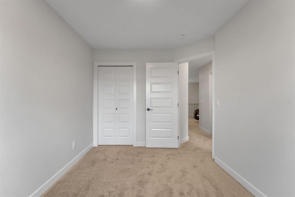 445 Lewiston Landing Ne, Calgary, AB - Indoor Photo Showing Other Room