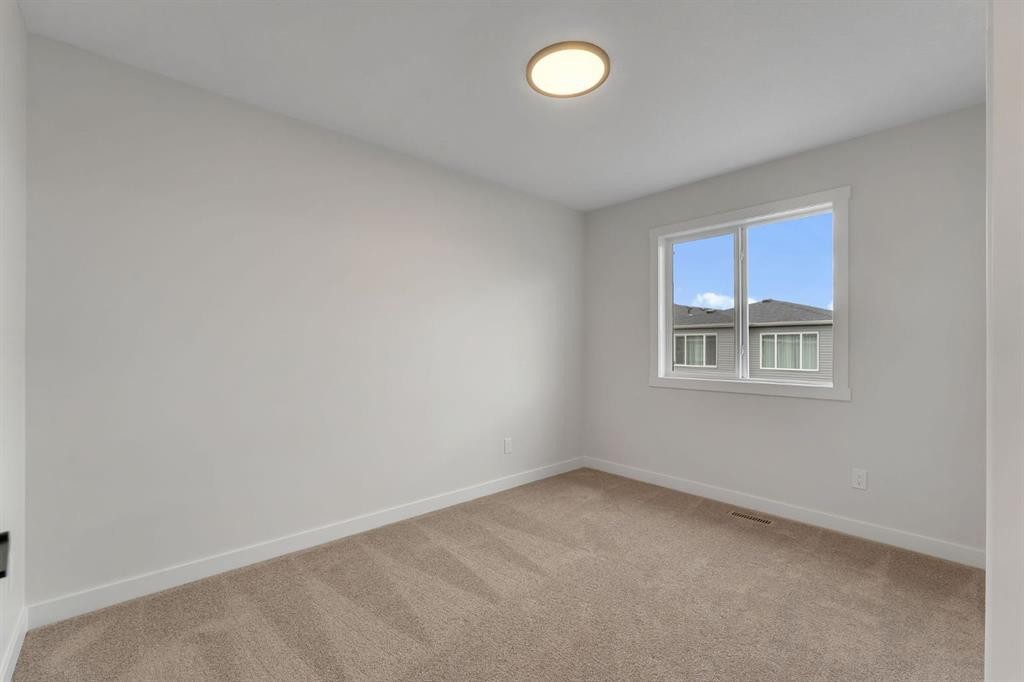 445 Lewiston Landing Ne, Calgary, AB - Indoor Photo Showing Other Room