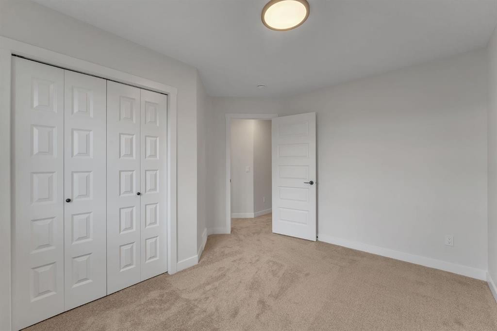 445 Lewiston Landing Ne, Calgary, AB - Indoor Photo Showing Other Room
