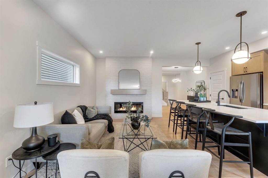 445 Lewiston Landing Ne, Calgary, AB - Indoor Photo Showing Other Room With Fireplace