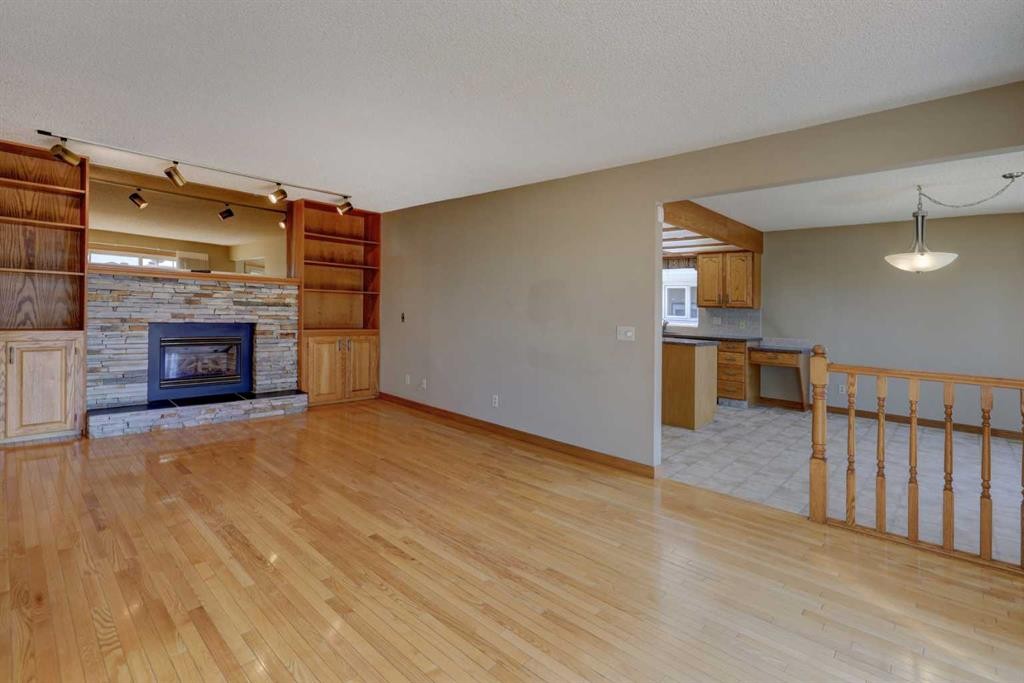2328 Munro Drive Ne, Calgary, AB - Indoor Photo Showing Other Room With Fireplace
