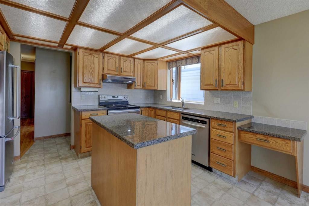 2328 Munro Drive Ne, Calgary, AB - Indoor Photo Showing Kitchen With Double Sink