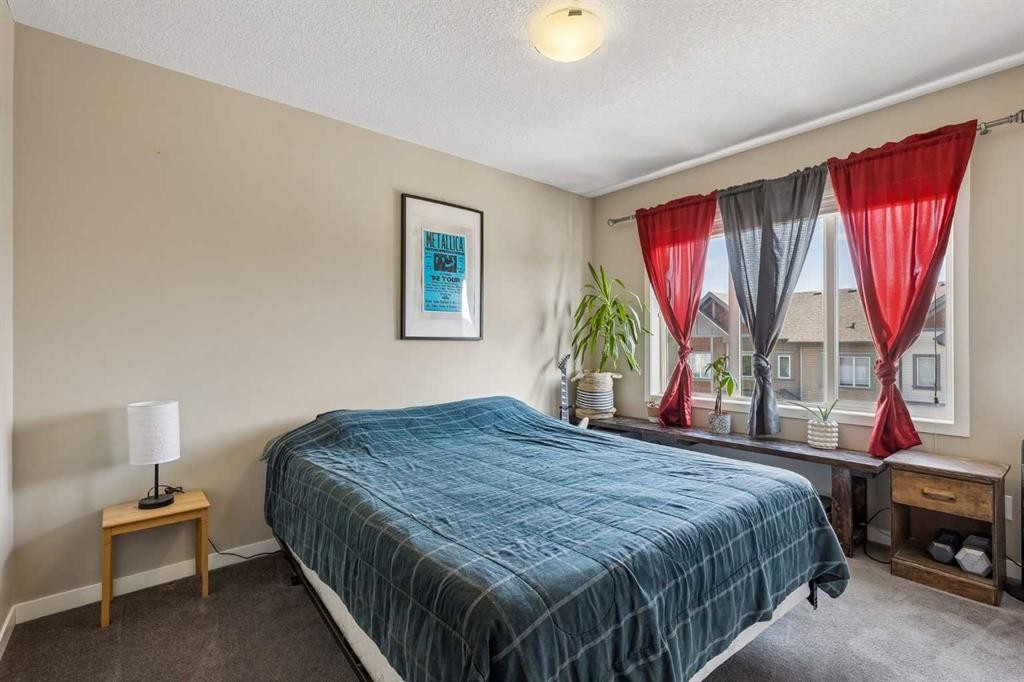 213 Copperpond Villas Se, Calgary, AB - Indoor Photo Showing Bedroom