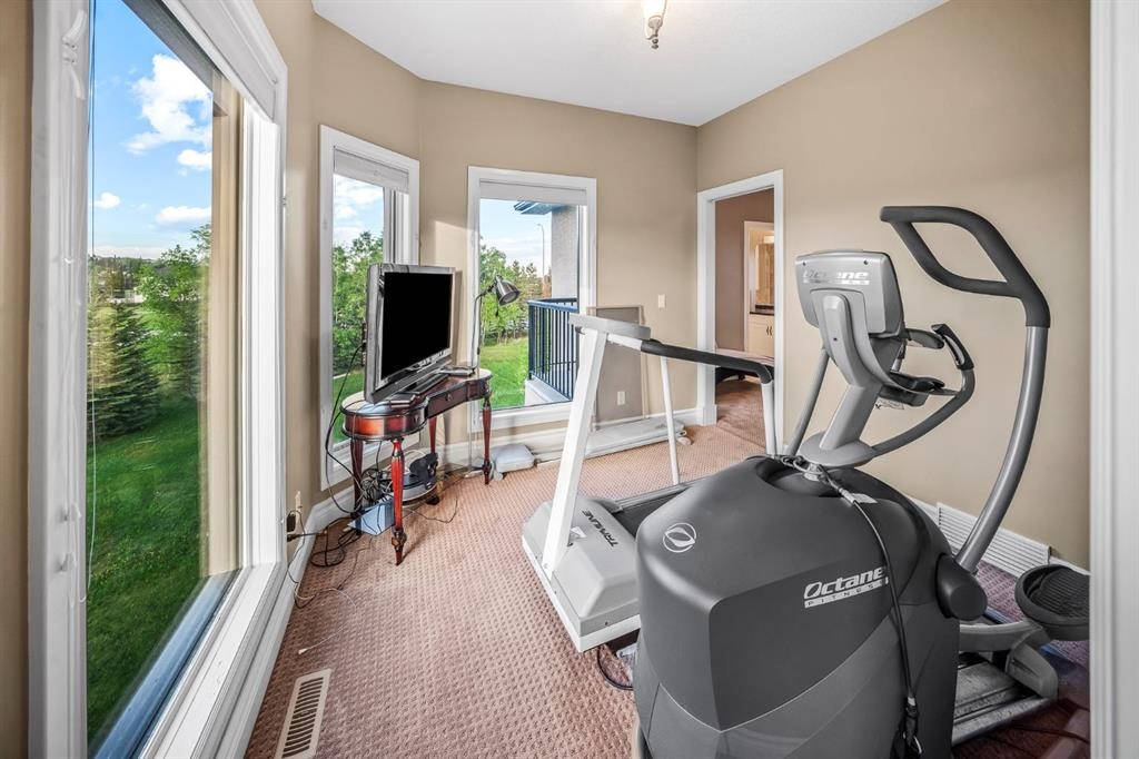40 Blueridge Bay, Rural Rocky View County, AB - Indoor Photo Showing Gym Room