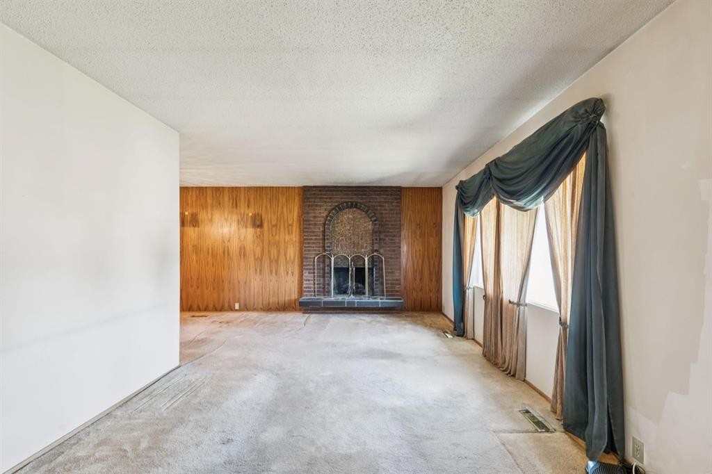 1132 Hunterston Hill Nw, Calgary, AB - Indoor Photo Showing Other Room With Fireplace