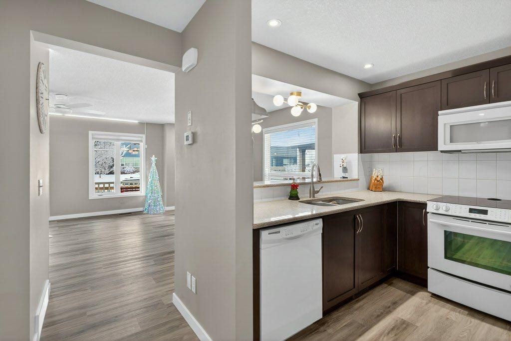 1012 Windsong Drive Sw, Airdrie, AB - Indoor Photo Showing Kitchen With Double Sink