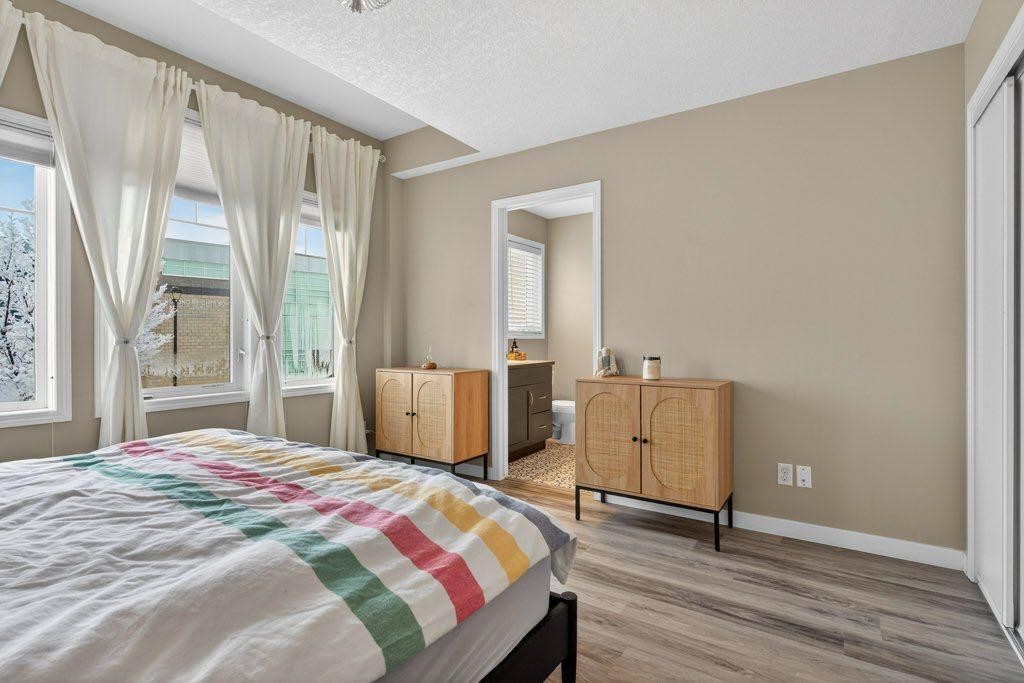 1012 Windsong Drive Sw, Airdrie, AB - Indoor Photo Showing Bedroom