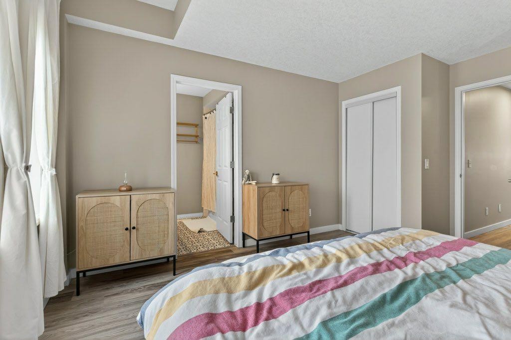 1012 Windsong Drive Sw, Airdrie, AB - Indoor Photo Showing Bedroom
