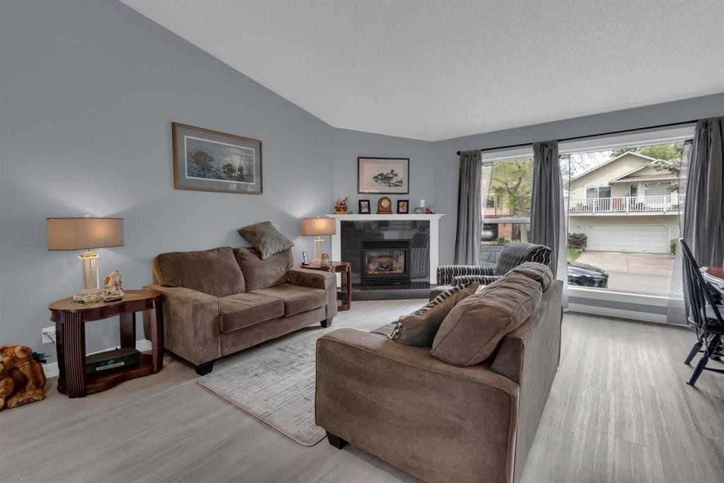 67 Deersaxon Circle Se, Calgary, AB - Indoor Photo Showing Living Room With Fireplace