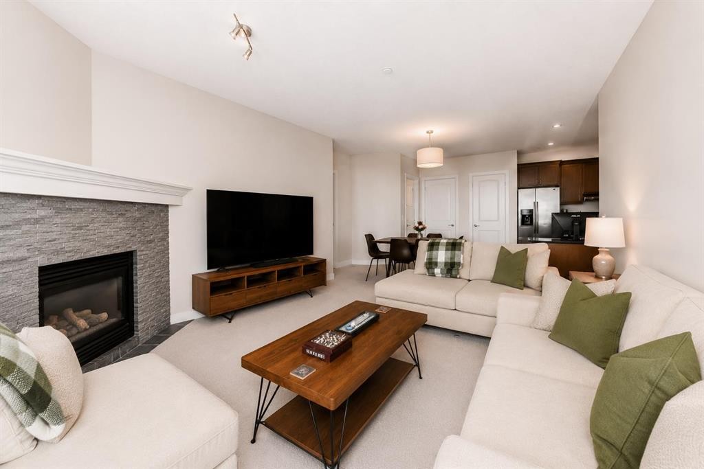 210-1005A Westmount Drive, Strathmore, AB - Indoor Photo Showing Living Room With Fireplace