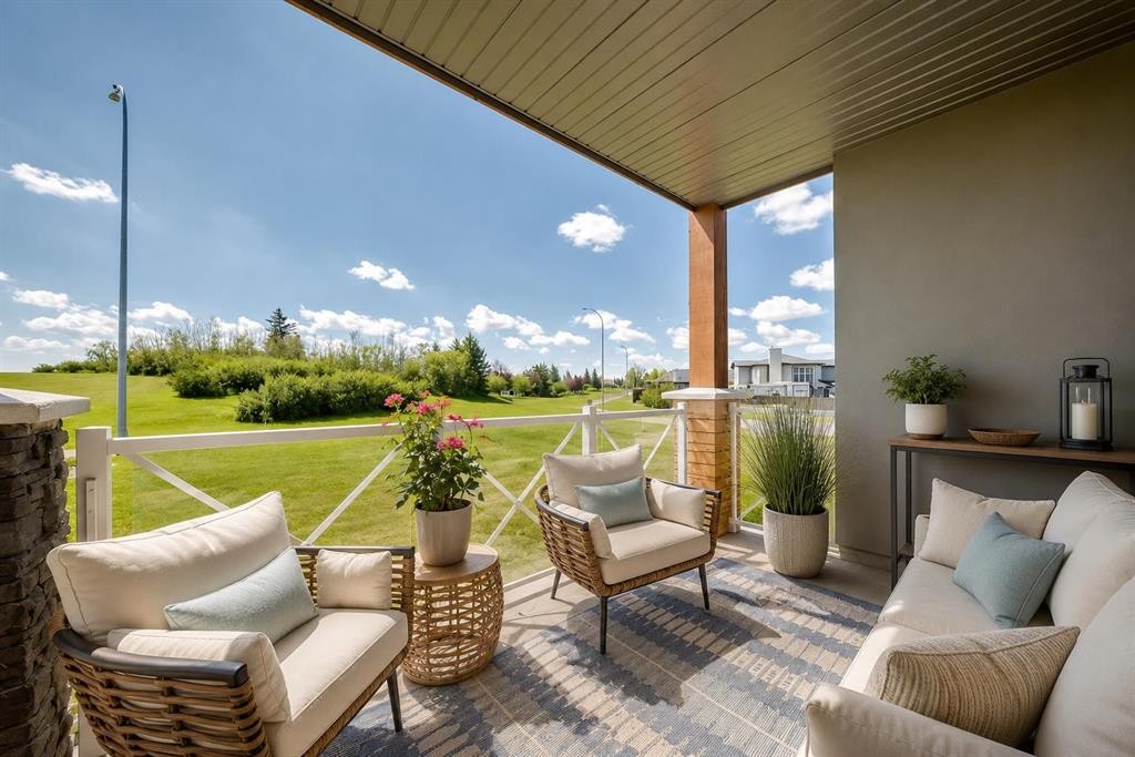 210-1005A Westmount Drive, Strathmore, AB - Outdoor With Deck Patio Veranda With Exterior