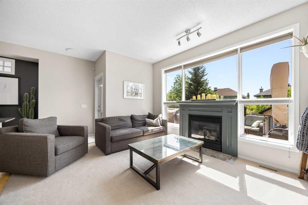 138 Cranwell Close Se, Calgary, AB - Indoor Photo Showing Living Room With Fireplace