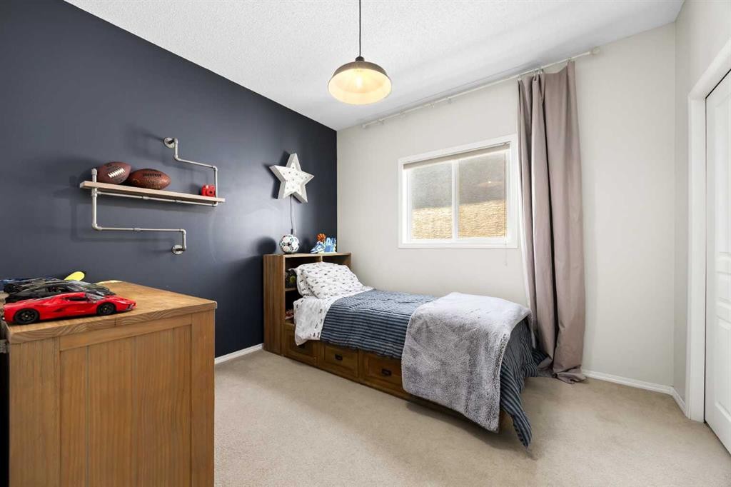 138 Cranwell Close Se, Calgary, AB - Indoor Photo Showing Bedroom