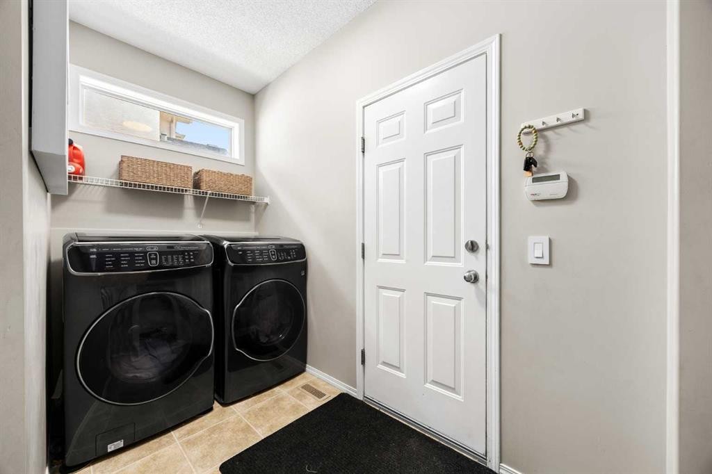 138 Cranwell Close Se, Calgary, AB - Indoor Photo Showing Laundry Room