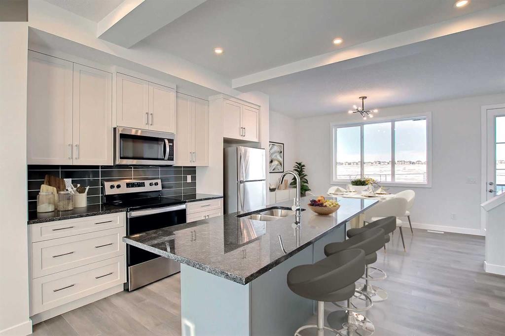 381 Waterford Boulevard, Chestermere, AB - Indoor Photo Showing Kitchen With Double Sink With Upgraded Kitchen