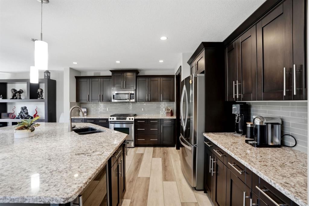 105 Cranridge Heights Se, Calgary, AB - Indoor Photo Showing Kitchen With Double Sink With Upgraded Kitchen