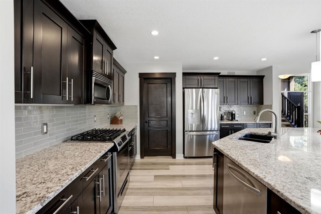 105 Cranridge Heights Se, Calgary, AB - Indoor Photo Showing Kitchen With Double Sink With Upgraded Kitchen