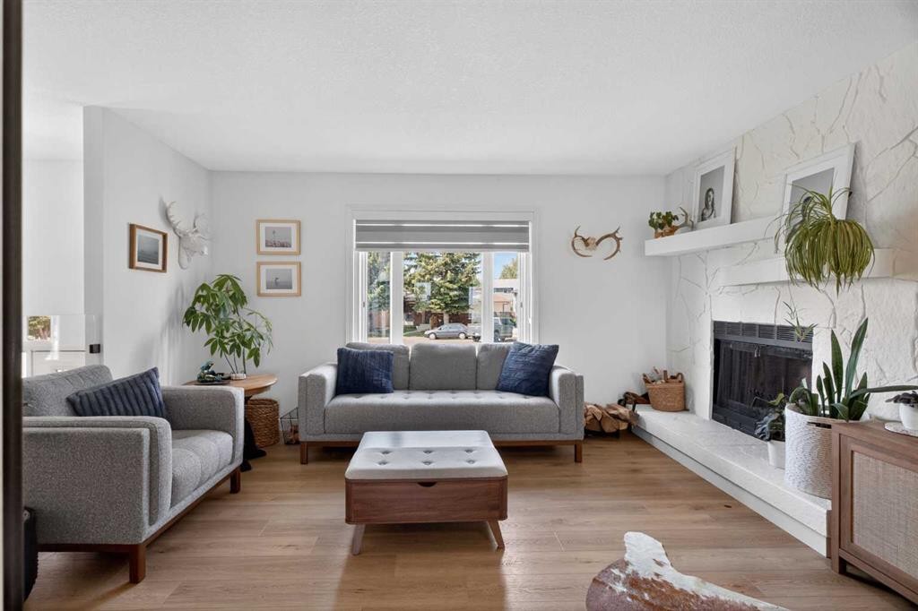 48 Shawcliffe Place, Calgary, AB - Indoor Photo Showing Living Room With Fireplace