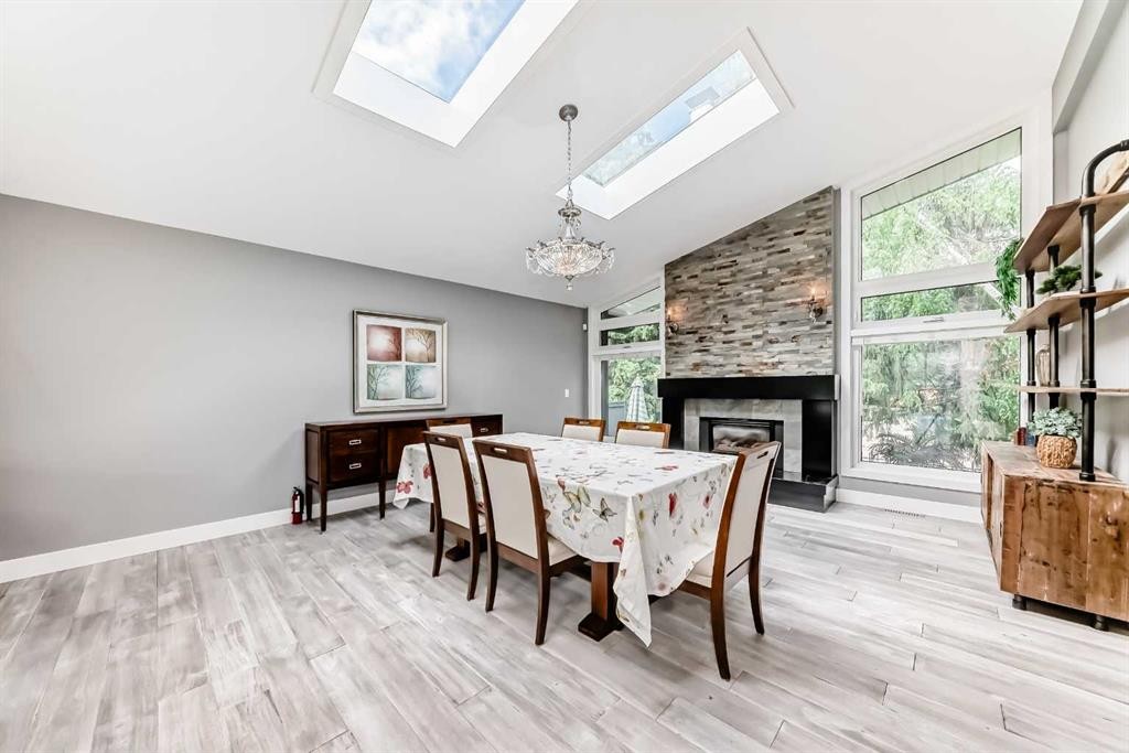 10412 Willowcrest Road Se, Calgary, AB - Indoor Photo Showing Dining Room With Fireplace