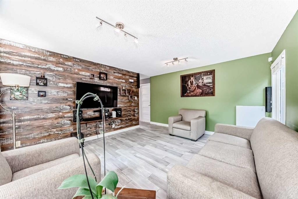 10412 Willowcrest Road Se, Calgary, AB - Indoor Photo Showing Other Room With Fireplace