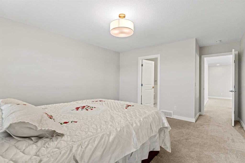283 Belvedere Drive Se, Calgary, AB - Indoor Photo Showing Bedroom