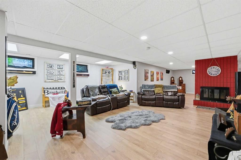 2406 26 Street, Nanton, AB - Indoor With Fireplace