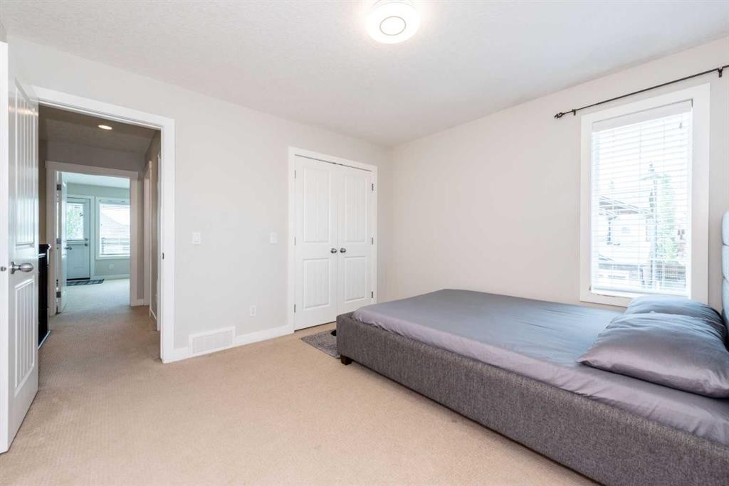 35 Aspen Stone Way Sw, Calgary, AB - Indoor Photo Showing Bedroom