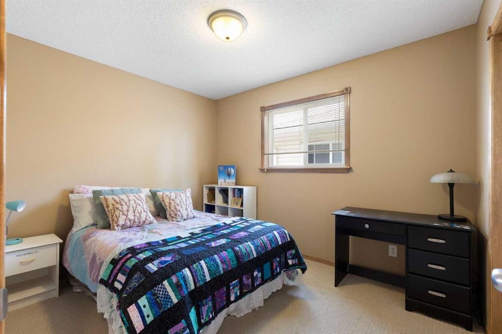 34 Tuscany Meadows Drive Nw, Calgary, AB - Indoor Photo Showing Bedroom