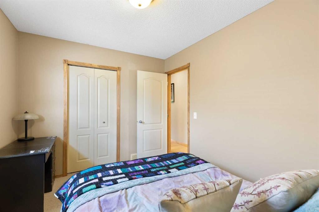 34 Tuscany Meadows Drive Nw, Calgary, AB - Indoor Photo Showing Bedroom
