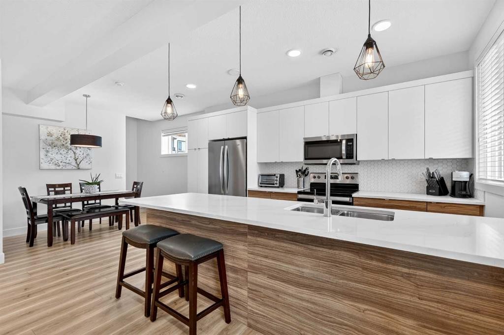 33-230 Seton Passage Se, Calgary, AB - Indoor Photo Showing Kitchen With Stainless Steel Kitchen With Double Sink With Upgraded Kitchen