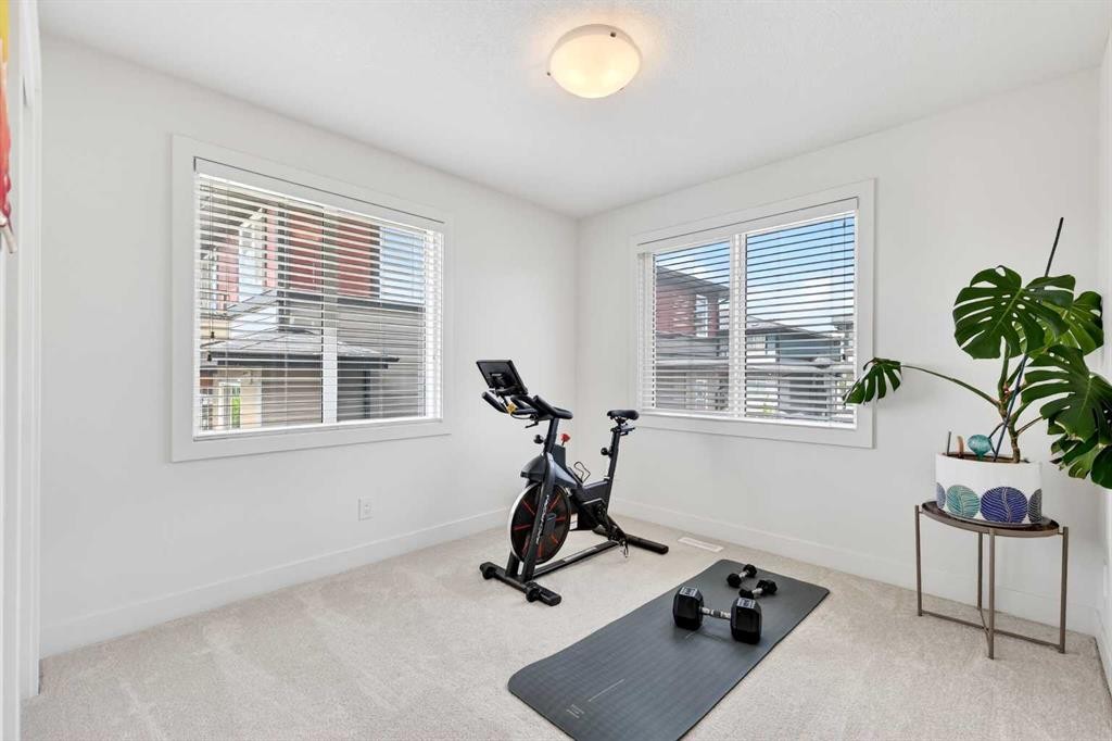 33-230 Seton Passage Se, Calgary, AB - Indoor Photo Showing Gym Room