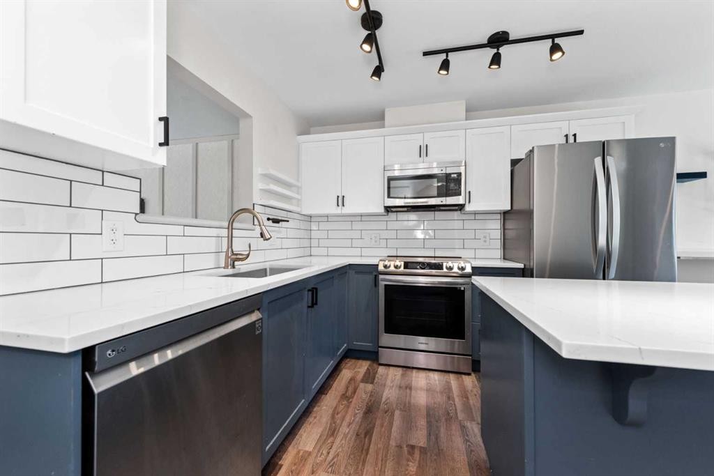 140 Cascades Pass, Chestermere, AB - Indoor Photo Showing Kitchen With Upgraded Kitchen