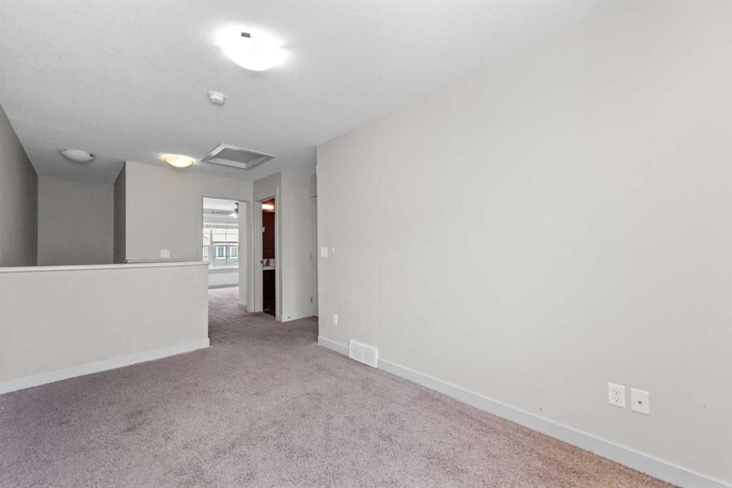 140 Cascades Pass, Chestermere, AB - Indoor Photo Showing Other Room