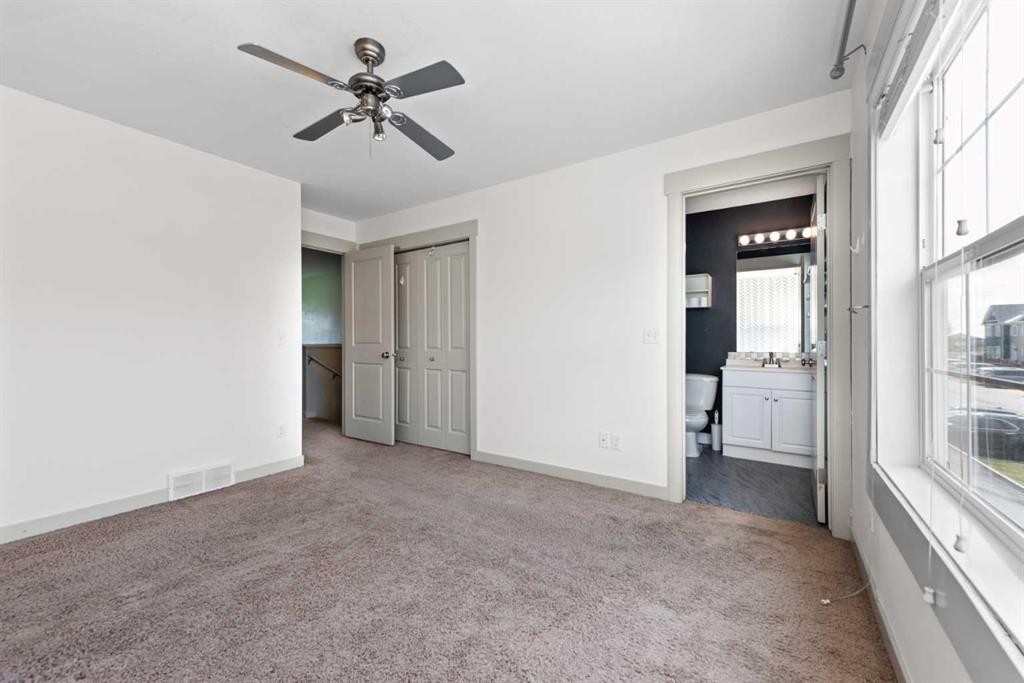 140 Cascades Pass, Chestermere, AB - Indoor Photo Showing Other Room