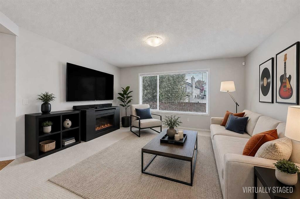 36 Mt Selkirk Close Se, Calgary, AB - Indoor Photo Showing Living Room