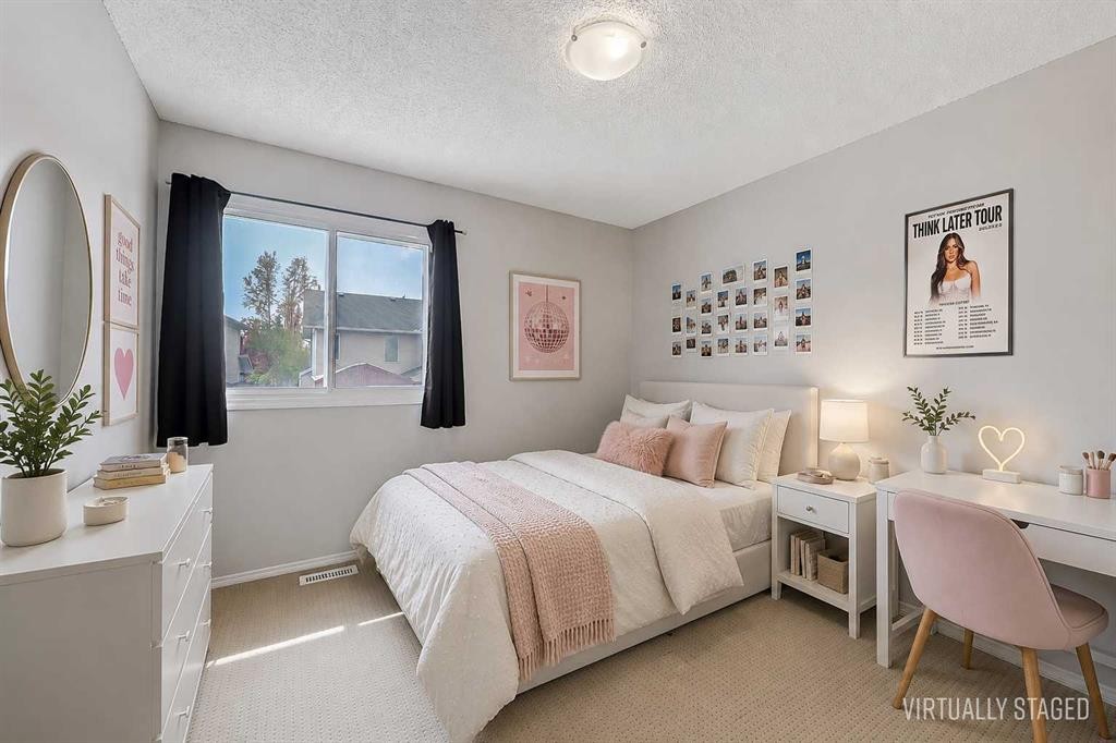 36 Mt Selkirk Close Se, Calgary, AB - Indoor Photo Showing Bedroom