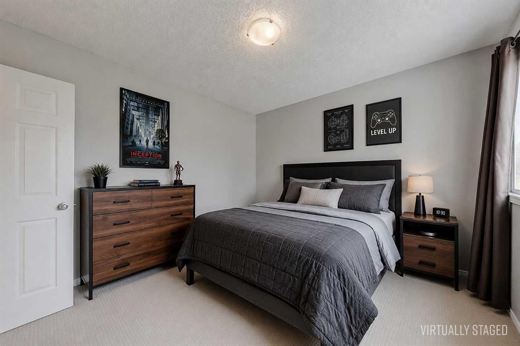 36 Mt Selkirk Close Se, Calgary, AB - Indoor Photo Showing Bedroom