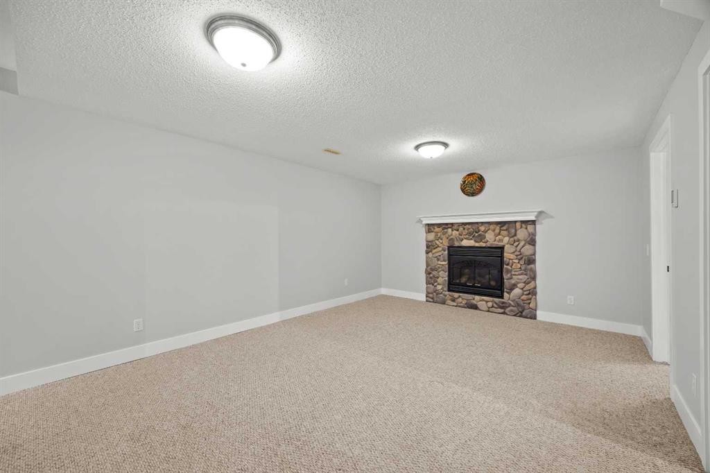 260 Riverside Mews Se, Calgary, AB - Indoor Photo Showing Living Room With Fireplace