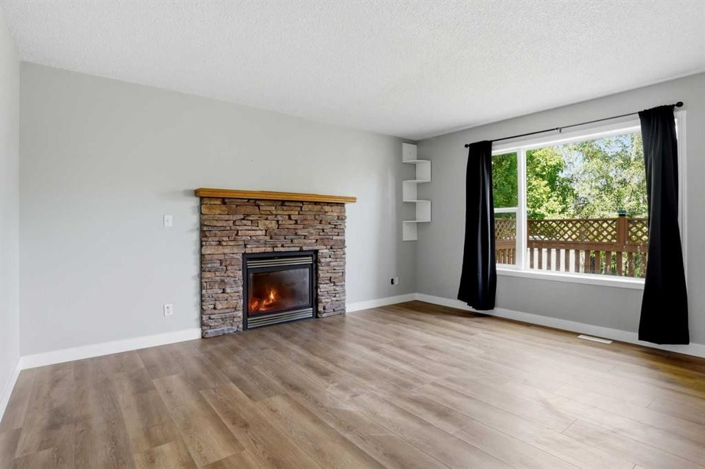 141 Shannon Square Sw, Calgary, AB - Indoor Photo Showing Living Room With Fireplace