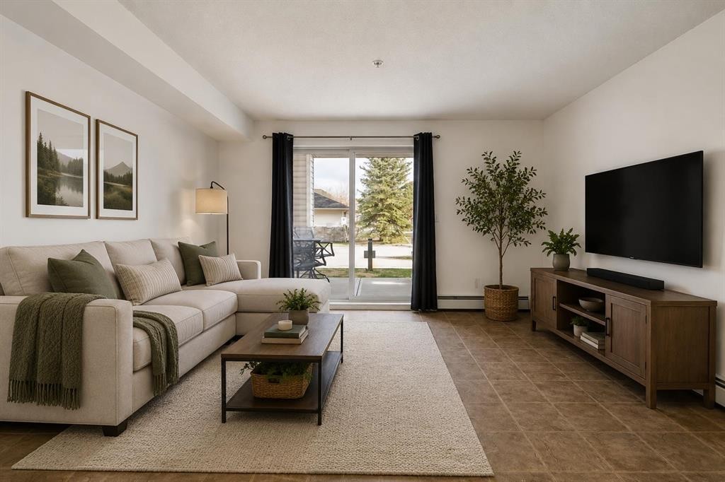 1128-2395 Eversyde Avenue Sw, Calgary, AB - Indoor Photo Showing Living Room