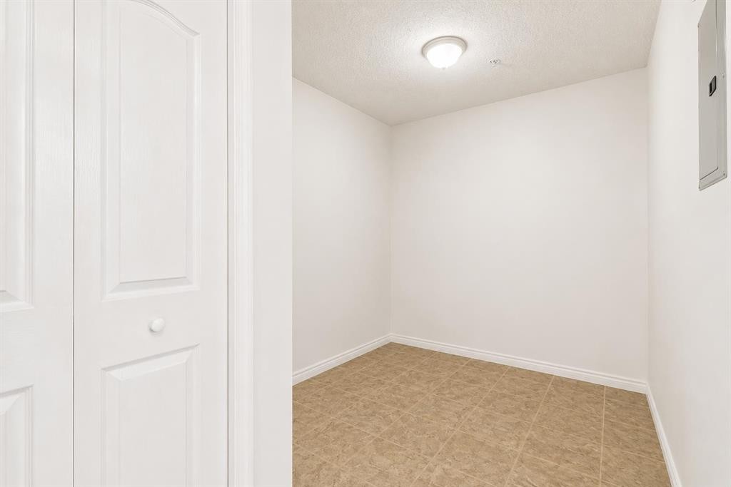 1128-2395 Eversyde Avenue Sw, Calgary, AB - Indoor Photo Showing Other Room