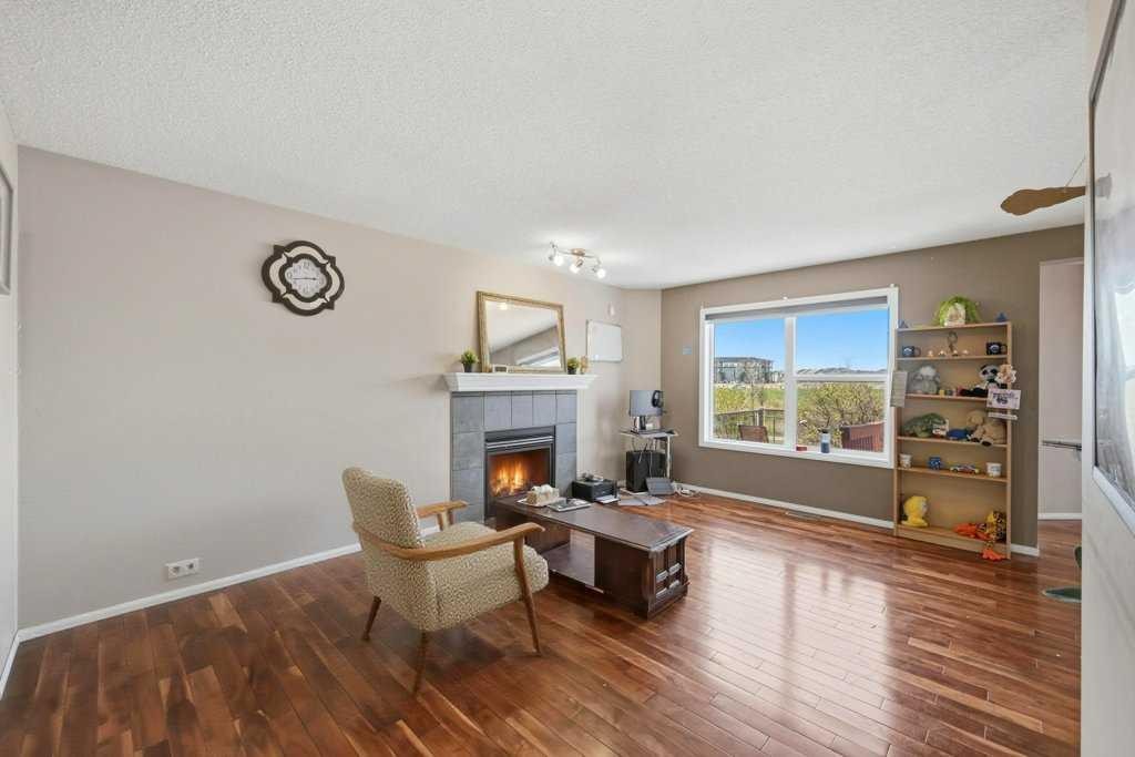 86 Saddlecrest Close Ne, Calgary, AB - Indoor Photo Showing Living Room With Fireplace