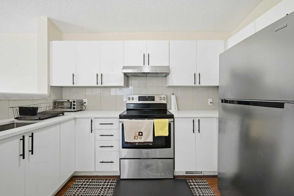 141 Martin Crossing Crescent Ne, Calgary, AB - Indoor Photo Showing Kitchen With Stainless Steel Kitchen