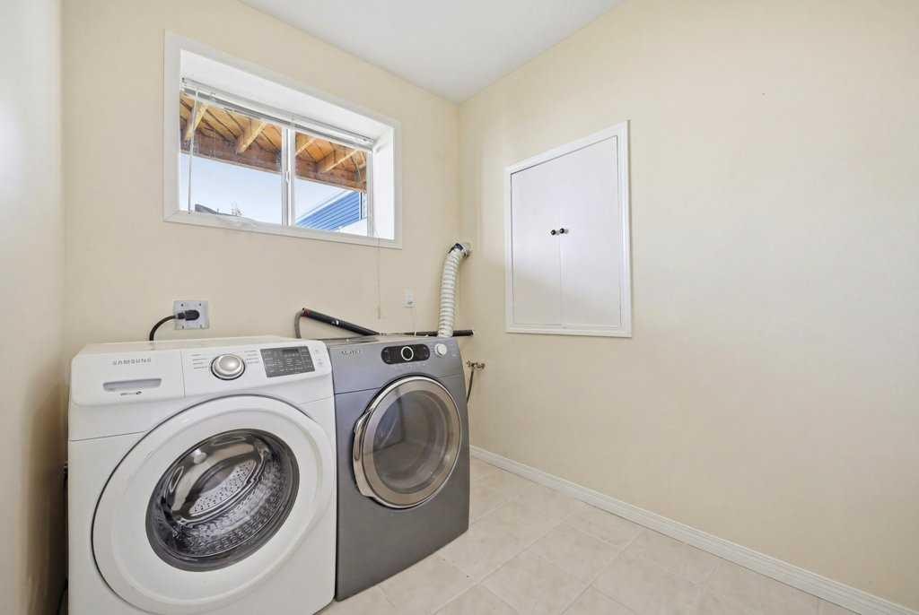 141 Martin Crossing Crescent Ne, Calgary, AB - Indoor Photo Showing Laundry Room