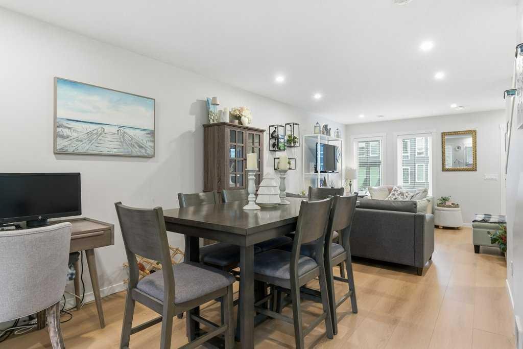 410-338 Seton Circle Se, Calgary, AB - Indoor Photo Showing Dining Room
