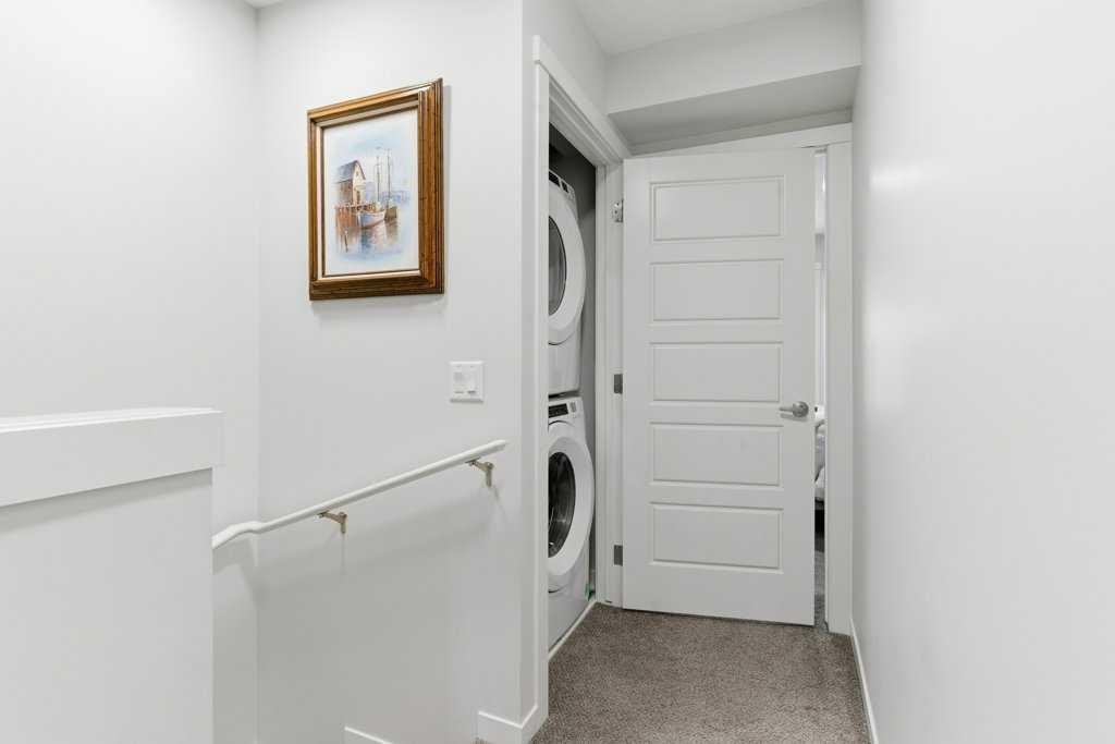 410-338 Seton Circle Se, Calgary, AB - Indoor Photo Showing Laundry Room